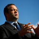 Maryland Democratic gubernatorial candidate Ben Jealous speaks with reporters, Oct. 24, 2018, as he greets voters at a bus stop in Baltimore.